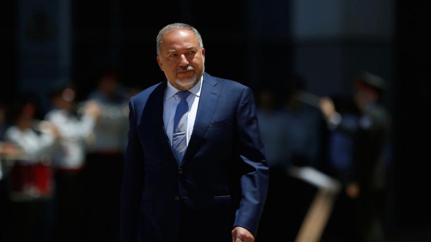 Israel's new Defence Minister, Avigdor Lieberman, head of far-right Yisrael Beitenu party, reviews an honour guard during a welcoming ceremony at the Defence Ministry in Tel Aviv, Israel May 31, 2016. REUTERS/Ronen Zvulun - RTX2EXRI