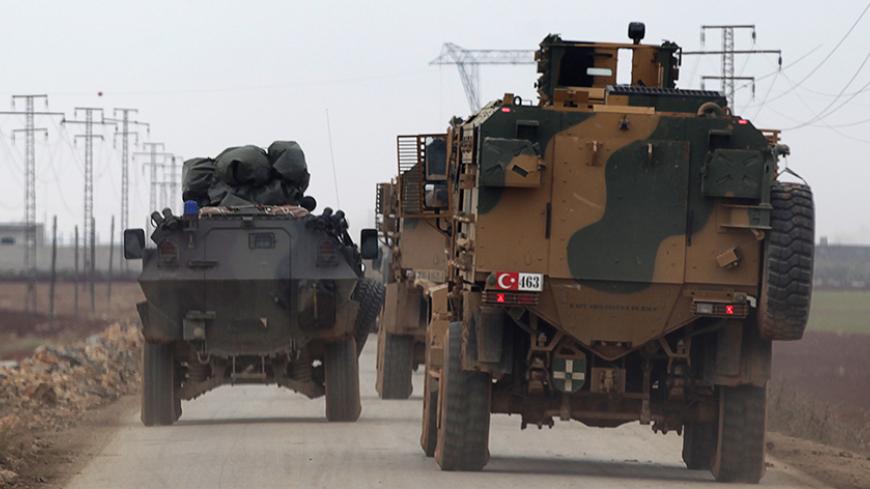 Turkish military vehicles drive in the Syrian rebel-held town of al-Rai, as they head towards the northern Syrian town of al-Bab, Syria January 4, 2017. REUTERS/Khalil Ashawi - RTX2XITU