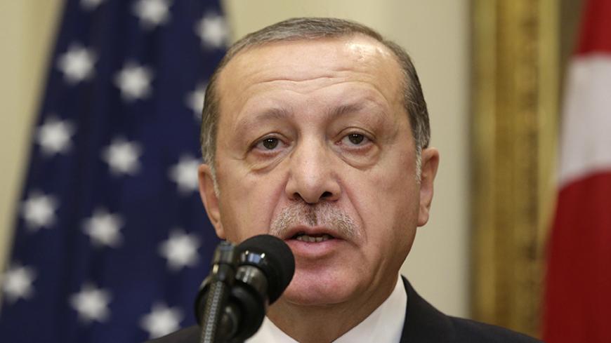 Turkey's President Recep Tayyip Erdogan delivers a statement to reporters alongside U.S President Donald Trump after their meeting at the White House in Washington, U.S. May 16, 2017. REUTERS/Kevin Lamarque - RTX363JM