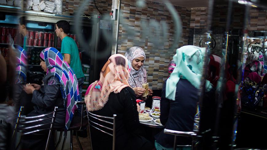 RAMALLAH, WEST-BANK - SEPTEMBER 23: Palestinians eat in a restaurant on September 23, 2013 in Ramallah, West-Bank. The West Bank and Gaza Strip are inhabited by an estimated 3.33 million Palestinians who live in a region which has a long history as a crossroads for religion, culture, commerce and politics. (Photo by Ilia Yefimovich/Getty Images)