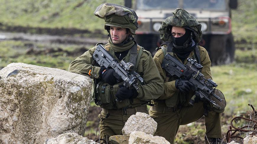 Israeli soldiers from the Golani Brigade take part in a military training exercise in the Israeli-annexed Golan Heights near the border with Syria on January 19, 2015. Iran confirmed today that a general of its elite Revolutionary Guards died in an Israeli strike on Syria that also killed six members of Lebanese militant group Hezbollah.  AFP PHOTO / JACK GUEZ        (Photo credit should read JACK GUEZ/AFP/Getty Images)