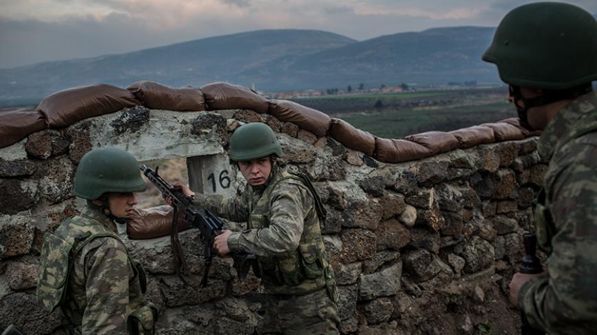 KILIS, TURKEY - MARCH 02:  Turkish soldiers from the 1st Border Regiment Command run through alert drills at a military outpost on the Turkey/Syria border on March 2, 2017 in Kilis, Turkey.  The military exercises were held to display the new border wall and new security measures such as thermal scanning and patrols by the new Tactical Armoured Reconnaissance vehicles (Kobra-2) that are being used to tighten Turkey's border. The government announced this week that more than half of the 511-kilometer wall ha