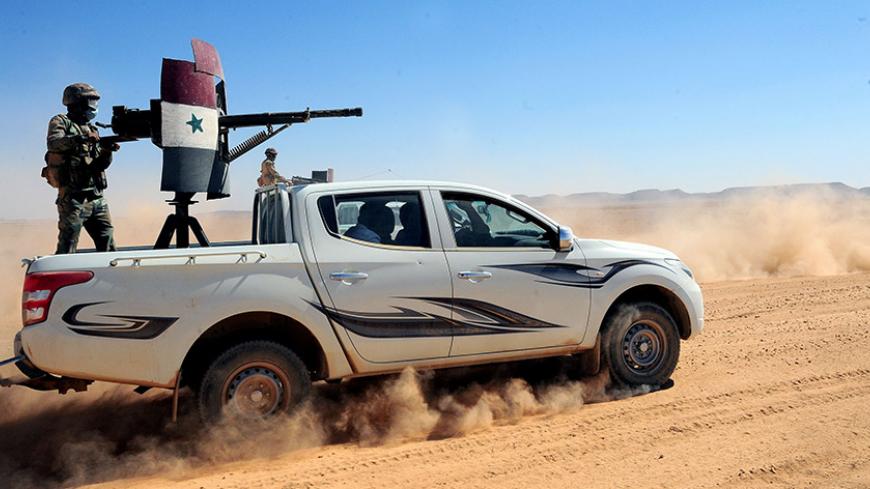 Forces loyal to Syria's President Bashar al-Assad ride on pick-up trucks mounted with weapons in the Badia, in the southeast Syrian desert, in this handout picture provided by SANA on June 13, 2017, Syria. SANA/Handout via REUTERS ATTENTION EDITORS - THIS PICTURE WAS PROVIDED BY A THIRD PARTY. REUTERS IS UNABLE TO INDEPENDENTLY VERIFY THE AUTHENTICITY, CONTENT, LOCATION OR DATE OF THIS IMAGE. - RTS16TTU