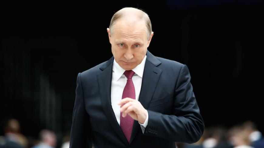 Russian President Vladimir Putin arrives for a meeting with journalists following a live nationwide broadcast call-in in Moscow, Russia June 15, 2017. REUTERS/Sergei Karpukhin     TPX IMAGES OF THE DAY - RTS177P1
