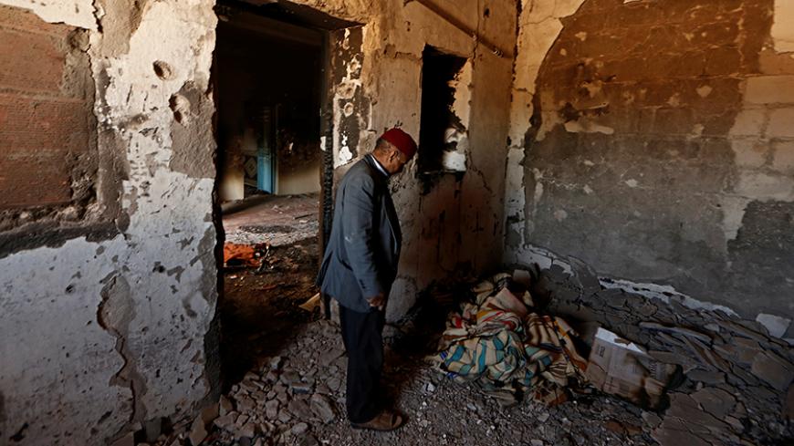 Hamid Ishi stands in his house, which was squatted by Islamic State jihadists and damaged during fighting with government forces, in Ben Guerdane, Tunisia April 10, 2016. After a U.S. air strike killed a Tunisian jihadist commander in western Libya in late February, dozens of Islamic State fighters sneaked across the border into Tunisia and attacked an army barracks and police bases in the town of Ben Guerdane. In the battle that followed, Islamic State militants shot dead local Tunisian anti-terrorism chie