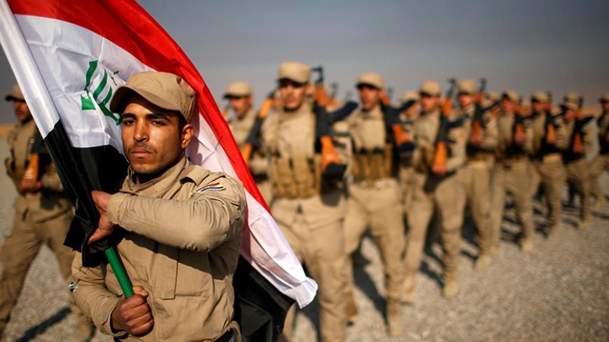 Iraqi fighters from Hashid Shaabi take part in a training at Makhmur camp in Iraq December 11, 2016. REUTERS/Mohammed Salem  TPX IMAGES OF THE DAY     TPX IMAGES OF THE DAY - RTX2UHUT