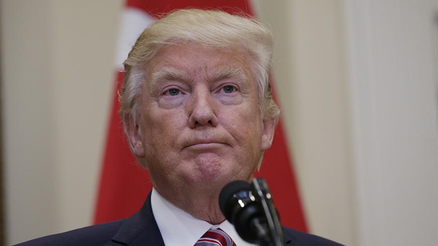 U.S President Donald Trump listens to Turkey's President Recep Tayyip Erdogan as they give statements to reporters in the Roosevelt Room of the White House in Washington, U.S. May 16, 2017. REUTERS/Kevin Lamarque - RTX363JL