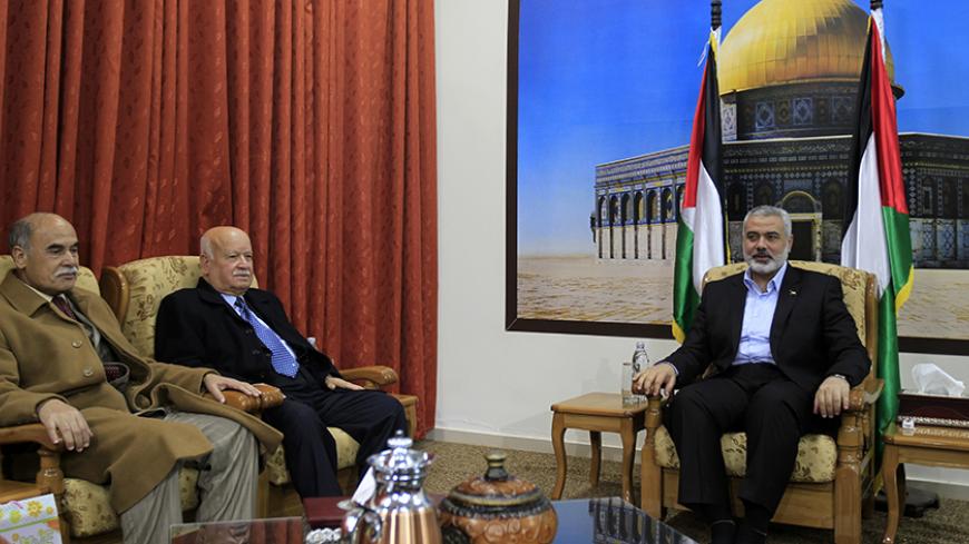 Hamas leader in Gaza Ismail Haniyeh (R) chairs a meeting between Hamas and Fatah in his house in Gaza City on January 14, 2012 in a fresh move to push ahead with the rapprochement signed last April following years of bitter rivalry. On left are Fatah members Abdullah Abu Samhadana (L) and Zakaria al-Agha (2nd L). AFP PHOTO/MAHMUD HAMS (Photo credit should read MAHMUD HAMS/AFP/Getty Images)