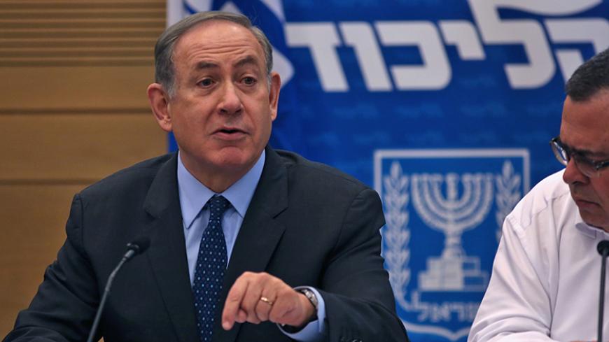 Israeli Prime Minister and Likud party leader Benjamin Netanyahu gestures during a meeting with party members at the Knesset, the Israeli parliament in Jerusalem, on January 30, 2017.  / AFP / MENAHEM KAHANA        (Photo credit should read MENAHEM KAHANA/AFP/Getty Images)