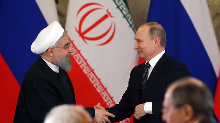 MOSCOW, RUSSIA - MARCH 28: (RUSSIA OUT) Russian President Vladimir Putin (R) greets Iran's President Hassan Rouhani (L) during their meeting at the Grand Kremlin Palace on March 28, 2017 in Moscow, Russia. President of Islamic Republic of Iran Hassan Rouhani is having a state visit to Russia. (Photo by Mikhail Svetlov/Getty Images)