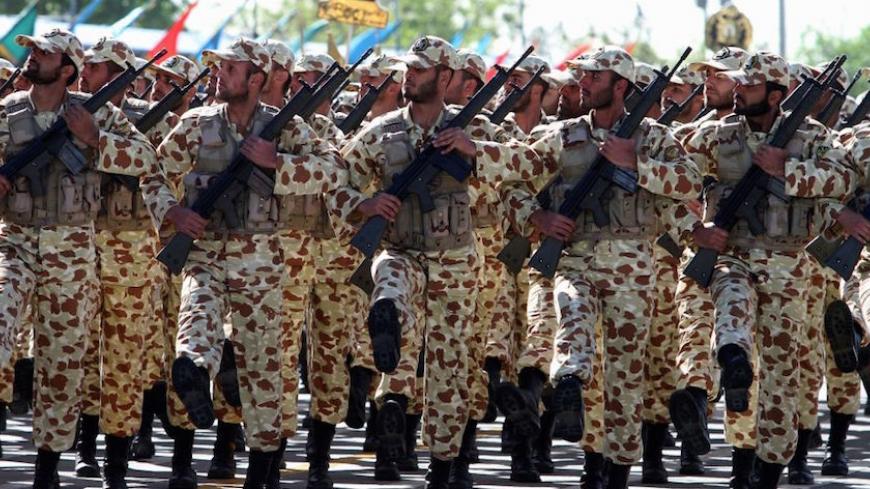 Iranian soldiers march during a parade marking the country's Army Day, on April 18, 2017, in Tehran. / AFP PHOTO / ATTA KENARE (Photo credit should read ATTA KENARE/AFP/Getty Images)