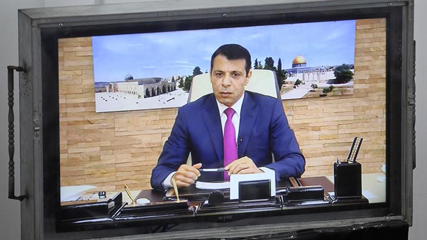 Exiled former senior Fatah member Mohammed Dahlan attends a Palestinian legislative Council meeting in Gaza City through video conference from the United Arab Emirates on July 27, 2017 following developments at the Al-Aqsa Mosque compound.

Palestinians were set to return to pray at a sensitive Jerusalem holy site after Israeli authorities removed controversial new security measures, potentially ending a nearly two-week crisis that sparked deadly unrest. Dahlan, Palestinian president Mahmud Abbas's exiled r