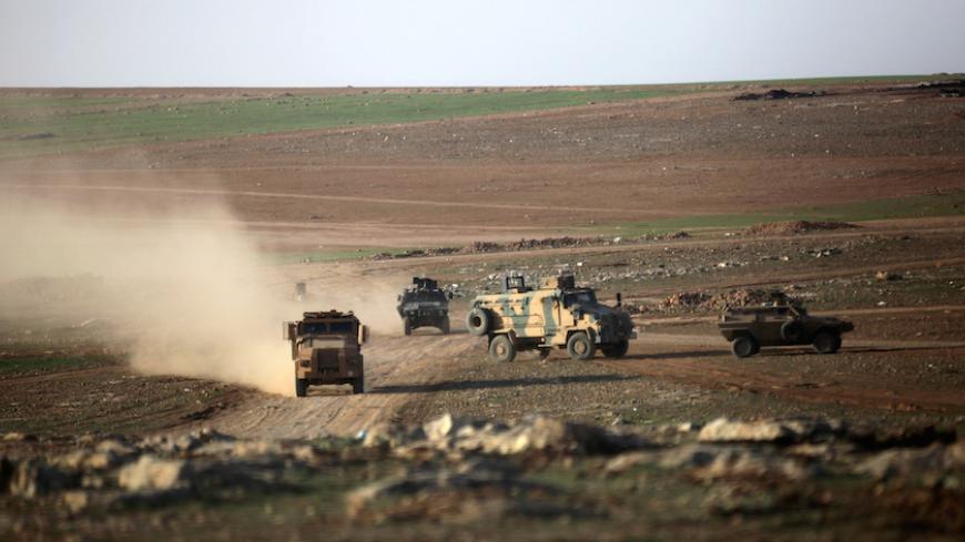 Turkish military vehicles drive east of al-Bab town, Syria March 9, 2017. REUTERS/Khalil Ashawi - RTS126QM