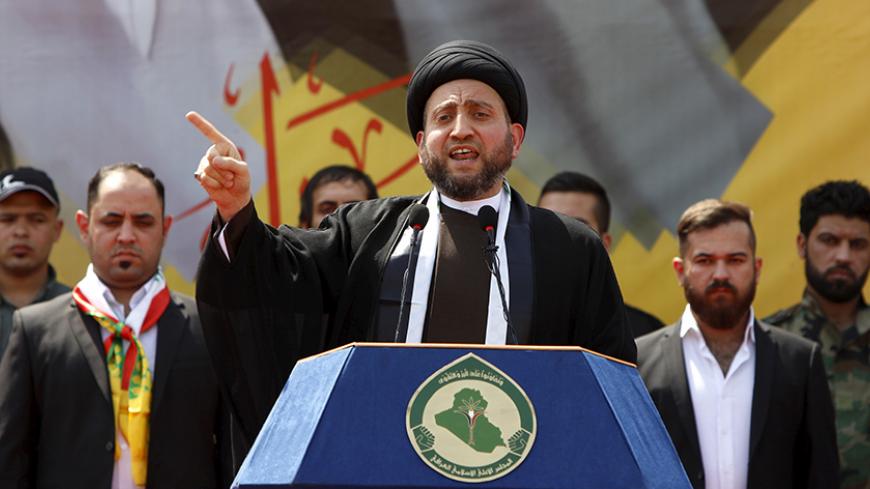 Ammar al-Hakim, leader of the Islamic Supreme Council of Iraq (ISCI), gives a speech during a ceremony to commemorate his late uncle, cleric Mohammad Baqer al-Hakim, in Baghdad, April 8, 2016. REUTERS/Ahmed Saad - RTSE68O