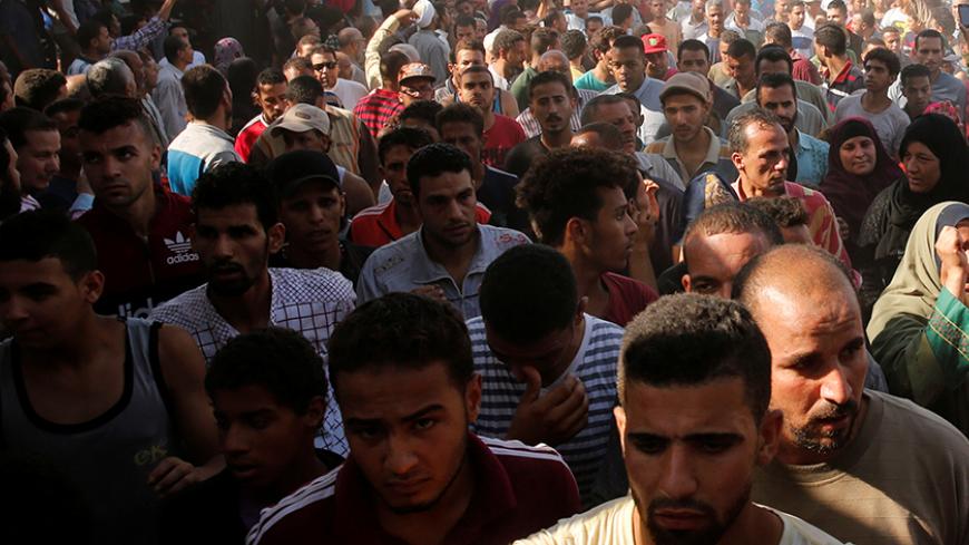 Egyptians shout solgans against President Abdel Fattah al-Sisi during the funeral of Syed Tafshan, who died in clashes with residents of the Nile island of al-Warraq island, when security forces attempted to demolish illegal buildings, in the south of Cairo, Egypt July 16, 2017. Picture taken July 16, 2017. REUTERS/Amr Abdallah Dalsh - RTX3C1PO