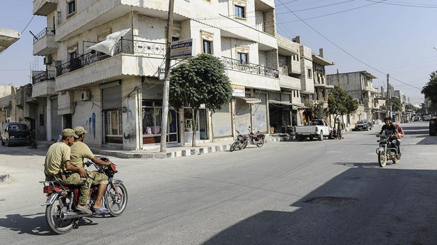 JARABLUS, SYRIA - AUGUST 31: Members of the Turkish-backed Free Syrian Army (FSA) patrol in the border town of Jarablus, August 31, 2016, Syria. Turkish troops and Turkey-backed rebels have been fighting Kurdish-led forces and IS since Turkey's incursion into Syria on Aug. 24. with the swift capture of Jarablus, a town a few km inside Syria that was held by Islamic State.(Photo by Defne Karadeniz/Getty Images)