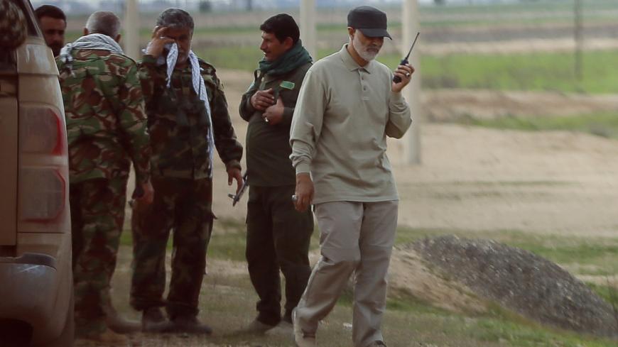Iranian Revolutionary Guard Commander Qassem Soleimani uses a walkie-talkie at the frontline during offensive operations against Islamic State militants in the town of Tal Ksaiba in Salahuddin province March 8, 2015. Picture taken March 8, 2015.   REUTERS/Stringer (IRAQ - Tags: CIVIL UNREST CONFLICT POLITICS) - RTR4TU0N
