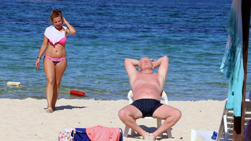 A tourist sunbathes on the beach in Sousse, Tunisia, August 2, 2017. Picture taken August 2, 2017. REUTERS/Zoubeir Souissi - RTS1A9P9