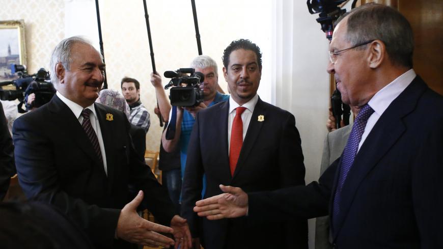 Russian Foreign Minister Sergei Lavrov (R) welcomes General Khalifa Haftar (L), commander in the Libyan National Army (LNA), during a meeting in Moscow, Russia August 14, 2017. REUTERS/Sergei Karpukhin - RTS1BPNE