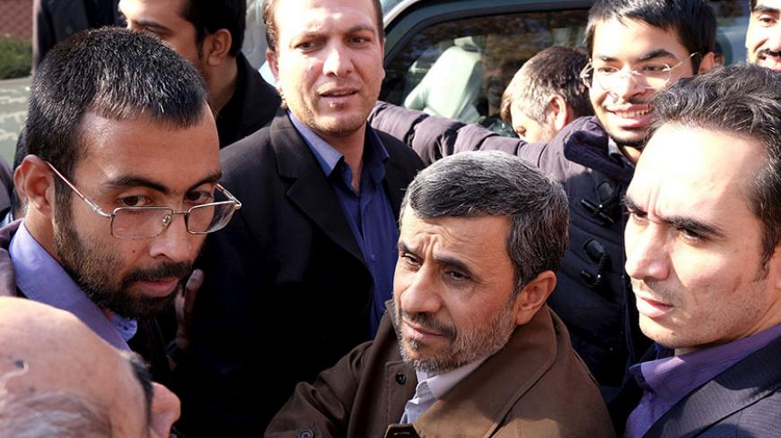 Former Iranian President Mahmoud Ahmadinejad (C front) listens to his supporters during the funeral ceremony of Iran's Ambassador to Lebanon Ghazanfar Roknabadi, who was killed in Saudi Arabia in a stampede at the haj pilgrimage, after Friday prayer in Tehran November 27, 2015. REUTERS/Raheb Homavandi/TIMA ATTENTION EDITORS - THIS IMAGE WAS PROVIDED BY A THIRD PARTY. FOR EDITORIAL USE ONLY. - RTX1W3E5