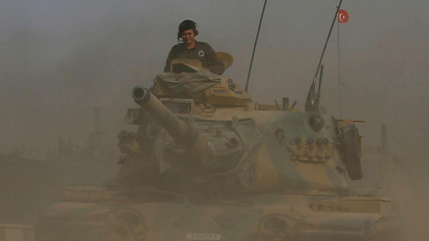 A Turkish army tank drives towards to the border in Karkamis on the Turkish-Syrian border in the southeastern Gaziantep province, Turkey, August 25, 2016. REUTERS/Umit Bektas - RTX2MYVZ
