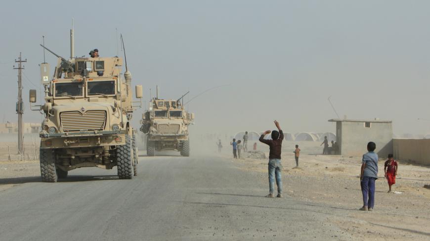 U.S. military and Iraqi army reinforcements deploy after the defeat of the Islamic State militants in Qayyara, Iraq, August 29, 2016. Picture taken August 29, 2016. REUTERS/Azad Lashkari - S1AETYKITNAB