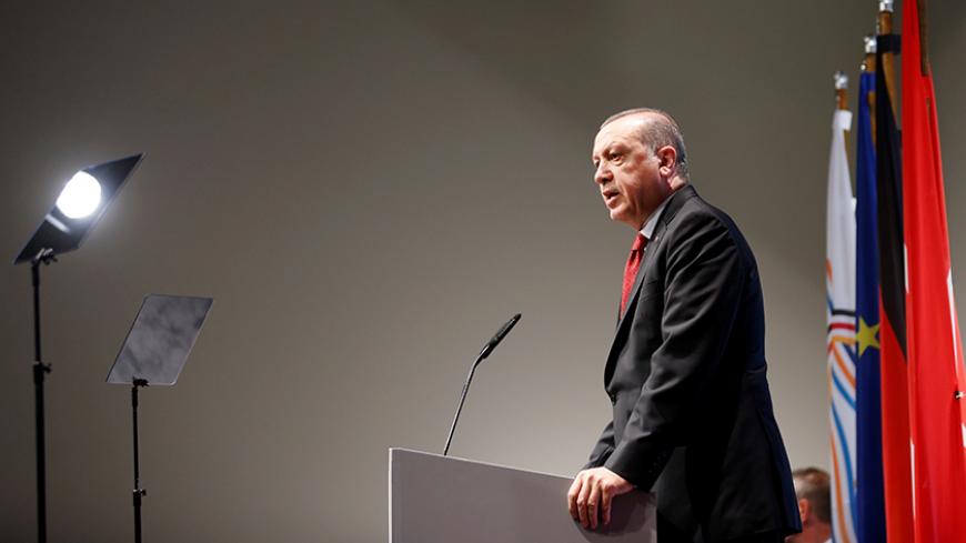 Turkish President Recep Tayyip Erdogan speaks during a news conference to present the outcome of the G20 leaders summit in Hamburg, Germany July 8, 2017. REUTERS/Axel Schmidt - RTX3AN8P