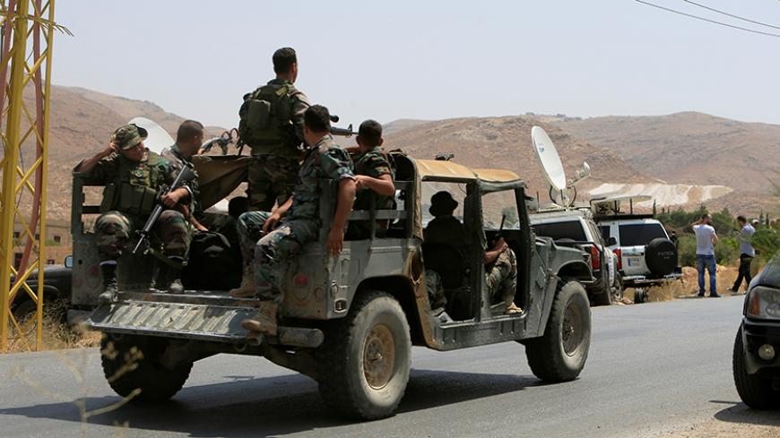 Lebanese army soldiers patrol a street in Labwe, at the entrance of the border town of Arsal, in eastern Bekaa Valley, Lebanon July 21, 2017. REUTERS/Ali Hashisho - RTX3CCJZ