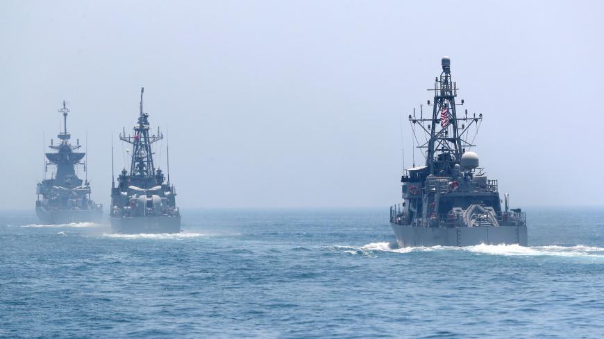 US and Qatari navy vessels are seen during a joint military exercise between Qatar and the US navy, in Doha, on June 16, 2017. 
The United States agreed a $12-billion warplane sale to Qatar and began manoeuvres with its military on June 15, re-affirming support for the emirate in the throes of a diplomatic crisis with its neighbours. / AFP PHOTO / KARIM JAAFAR        (Photo credit should read KARIM JAAFAR/AFP/Getty Images)