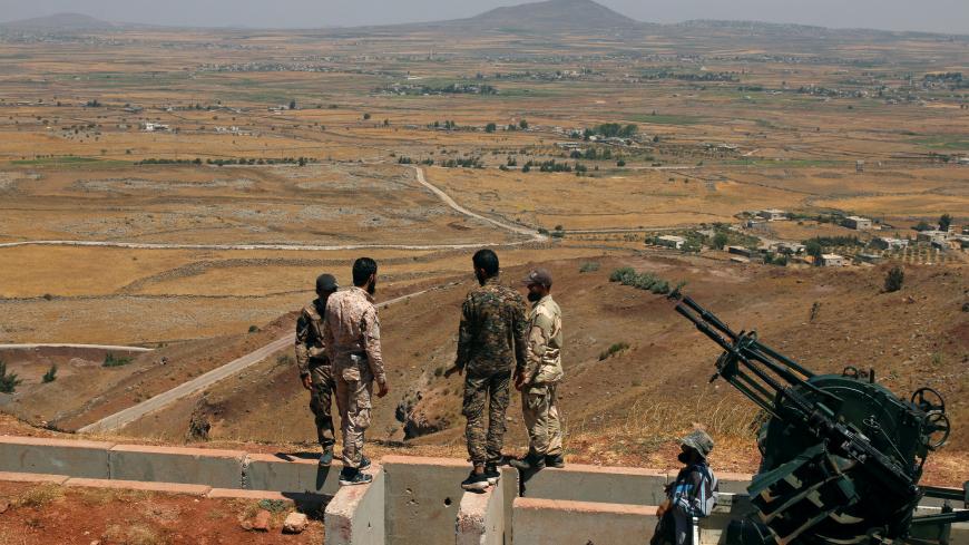 Free Syrian army fighters stand together in Quneitra countryside, Syria August 24, 2017. REUTERS/Alaa Al-Faqir - RC12C4FF3250