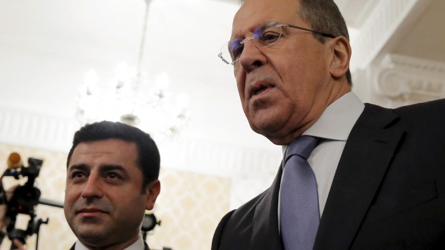 Russian Foreign Minister Sergei Lavrov (R) and co-chair of the pro-Kurdish Peoples' Democratic Party (HDP) Selahattin Demirtas arrive for a meeting in Moscow, Russia, December 23, 2015. REUTERS/Maxim Shemetov - GF10000274576