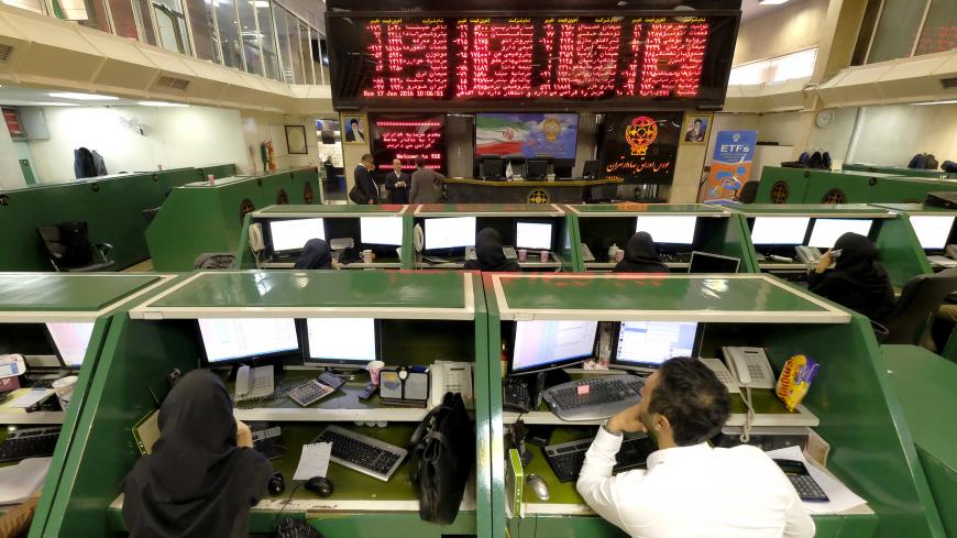 Stock market employees work at Tehran's Stock Exchange, Iran, January 17, 2016. REUTERS/Raheb Homavandi/TIMAATTENTION EDITORS - THIS IMAGE WAS PROVIDED BY A THIRD PARTY. FOR EDITORIAL USE ONLY.       TPX IMAGES OF THE DAY      - GF20000097701