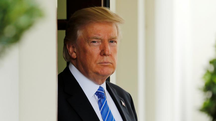 U.S. President Donald Trump waits to greet Malaysia's Prime Minister Najib Razak at the White House in Washington, U.S. September 12, 2017.  REUTERS/Jonathan Ernst - RC1F92CDA2B0