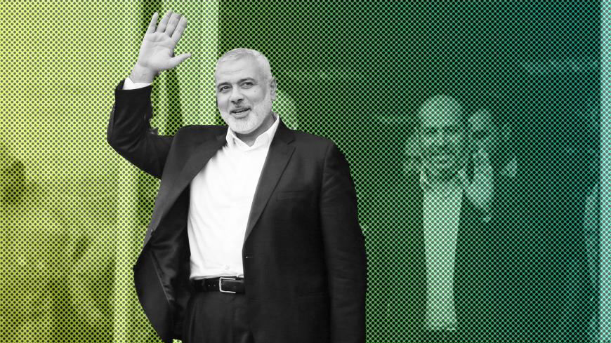 Hamas chief Ismail Haniyeh waves following his arrival at the Rafah border crossing in the southern Gaza Strip September 19, 2017. REUTERS/Ibraheem Abu Mustafa - RC1A5F1000E0