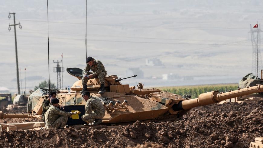 Turkish soldiers conduct military exercises near the Habur crossing gate between Turkey and Iraq on September 27, 2017 in the Silopi district, southeast Turkey. 
Iraqi soldiers on September 26 took part in a Turkish military drill close to the Iraqi border on Tuesday, an AFP photographer said, a day after Iraq's Kurdish region held a vote on independence.  / AFP PHOTO / ILYAS AKENGIN        (Photo credit should read ILYAS AKENGIN/AFP/Getty Images)
