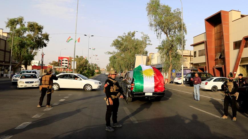 Iraqi SWAT troopers stand guard on a street during Kurds independence referendum in Kirkuk, Iraq September 25, 2017. REUTERS/Thaier Al-Sudani - RC1949AF51F0