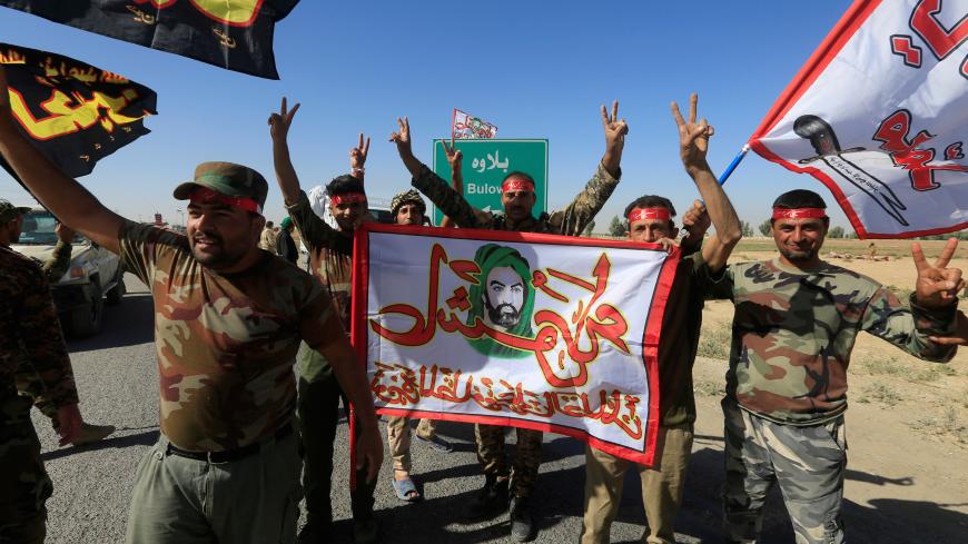 Shi'ite Popular Mobilization Forces (PMF) celebrate on the outskirts of Kirkuk, Iraq October 17, 2017. REUTERS/Alaa Al-Marjani TPX IMAGES OF THE DAY - RC14D2FF7B50