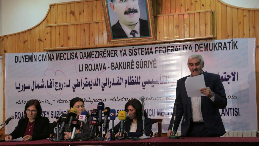 Hadiya Yousef (2nd R) and other delegates take part in a conference in Syria's Kurdish-controlled northern regions, in the town of Rmeilan, Hasaka province, Syria December 29, 2016. REUTERS/Rodi Said - RC1D18A26700