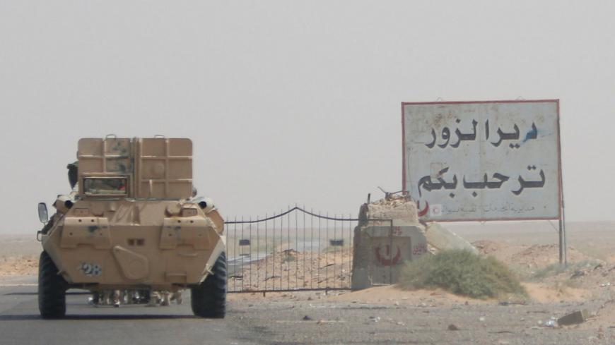 A road sign welcomes people to the town of Deir al-Zor in Syria September 20, 2017. Picture taken September 20, 2017. REUTERS/Omar Sanadiki - RC17375FEC20