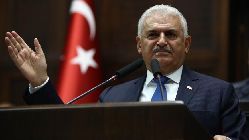 Turkish Prime Minister Binali Yildirim delivers a speech during the AK Party's group meeting at the Grand National Assembly of Turkey (TBMM) in Ankara on October 31, 2017. / AFP PHOTO / ADEM ALTAN (Photo credit should read ADEM ALTAN/AFP/Getty Images)