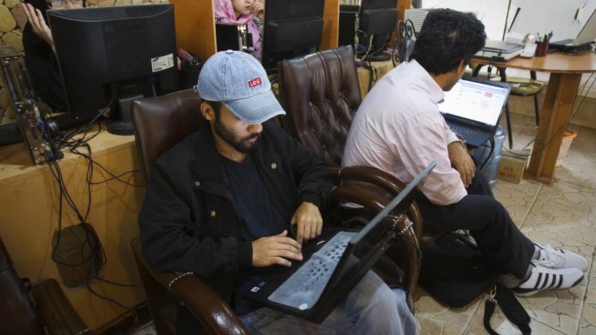 Customers use computers at an internet cafe in Tehran May 9, 2011. Websites like Facebook, Twitter, YouTube and countless others were banned shortly after the re-election of Iran's President Mahmoud Ahmadinejad and the huge street protests that followed. Seen by the government as part of a "soft war" waged by the enemies of the Islamic Republic, social networking and picture sharing sites were a vital communication tool for the anti-Ahmadinejad opposition -- more than a year before they played a similar rol
