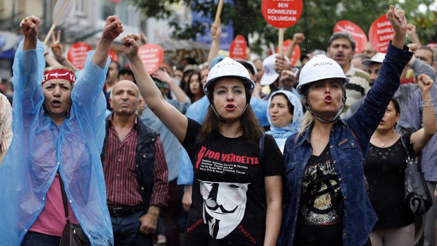 Alevi demonstrators shout anti-goverment slogans during a protest against the latest violence in Okmeydani, a working-class district in the center of the city, in Istanbul May 25, 2014. Two people died last week after clashes between Turkish police and protesters in Okmeydani, a working-class district of Istanbul, stirring fears of further unrest as the anniversary of last year's anti-government demonstrations approaches. Okmeydani is home to a community of Alevis, a religious minority in mainly Sunni Musli