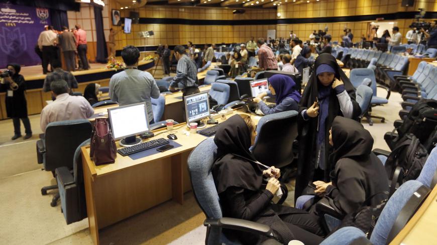Iranian journalists follow the results of the Presidential election at the Interior Ministry's press room in the capital Tehran on May 20, 2017. / AFP PHOTO / ATTA KENARE        (Photo credit should read ATTA KENARE/AFP/Getty Images)