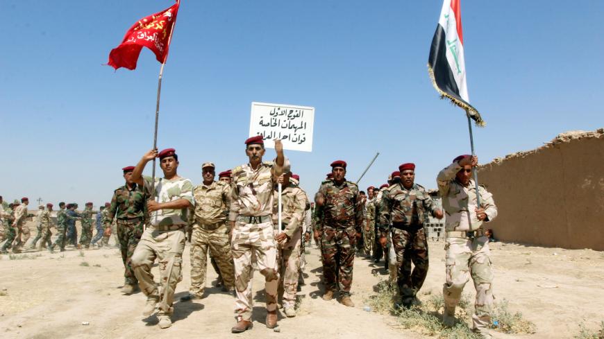 Popular Mobilisation Forces (PMF) march during a military parade in Daquq, nearby Kirkuk, Iraq August 5, 2017. REUTERS/Ako Rasheed - RC1FB5F9F700