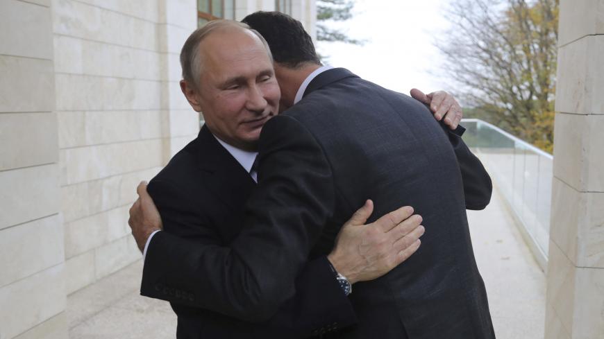 Russian President Vladimir Putin (L) welcomes Syrian President Bashar al-Assad during a meeting in the Black Sea resort of Sochi, Russia November 20, 2017. Picture taken November 20, 2017.  Sputnik/Mikhail Klimentyev/Kremlin via REUTERS  ATTENTION EDITORS - THIS IMAGE WAS PROVIDED BY A THIRD PARTY.     TPX IMAGES OF THE DAY - RC1E24874580