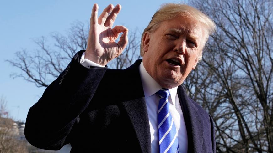 U.S. President Donald Trump gestures as he talks to the media on South Lawn of the White House in Washington, U.S., before his departure to Camp David, December 16, 2017. REUTERS/Yuri Gripas TPX IMAGES OF THE DAY - RC1695095ED0