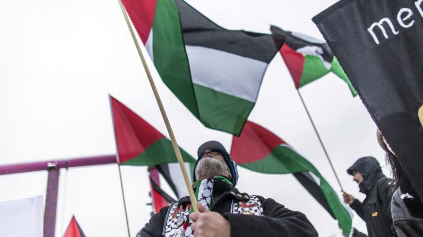 BERLIN, GERMANY - DECEMBER 06:  Protesters attend a demonstration organized by expat Palestinians against the visit of Israeli Prime Minister Benjamin Netanyahu near the Chancellery on December 6, 2012 in Berlin, Germany. Netanyahu is on a two-day visit to Germany as part of German-Israeli government consultations.  (Photo by Carsten Koall/Getty Images)
