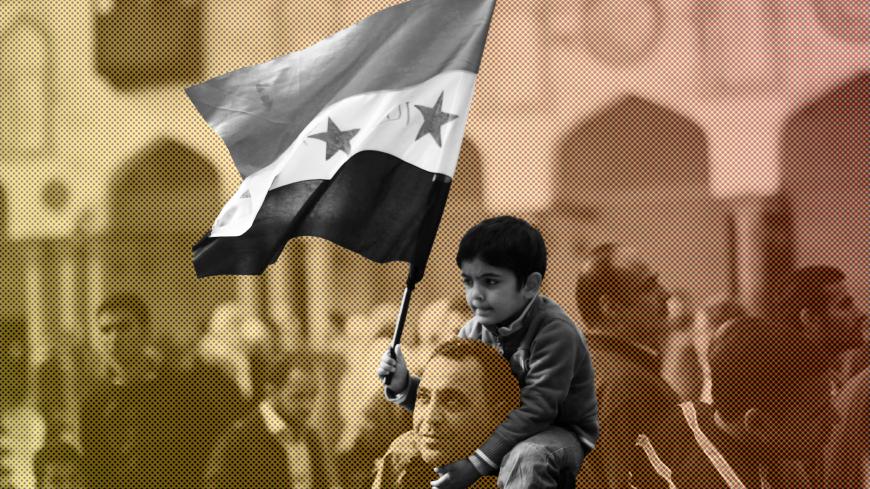 A Syrian man carries his son during a rally in support of the Syrian people and against Syria's President Bashar al-Assad at Al-Azhar mosque in Cairo, on December 28, 2012. Syrian warplanes launched air raids in Damascus province after overnight bombardments and clashes across the country, the Syrian Observatory for Human Rights said. AFP PHOTO/MAHMUD HAMS        (Photo credit should read MAHMUD HAMS/AFP/Getty Images)