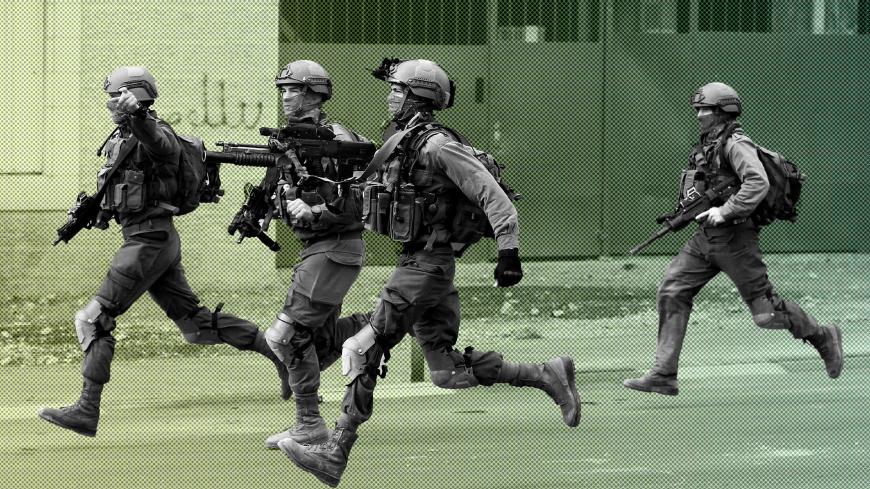 Israeli soldiers run during clashes with Palestinians at a protest against U.S. President Donald Trump's decision to recognize Jerusalem as the capital of Israel, in the West Bank city of Bethlehem December 20, 2017. REUTERS/Mussa Qawasma - RC1EB70CAD30