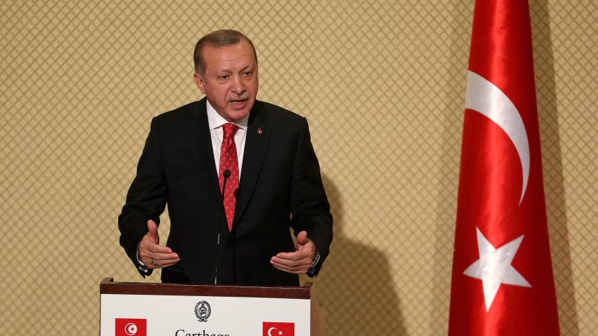 Turkey's President Tayyip Erdogan speaks during a news conference with Tunisia's President Beji Caid Essebsi (not pictured) at Carthage Palace in Tunis, Tunisia, December 27, 2017. REUTERS/Zoubeir Souissi - RC1C0962BF30